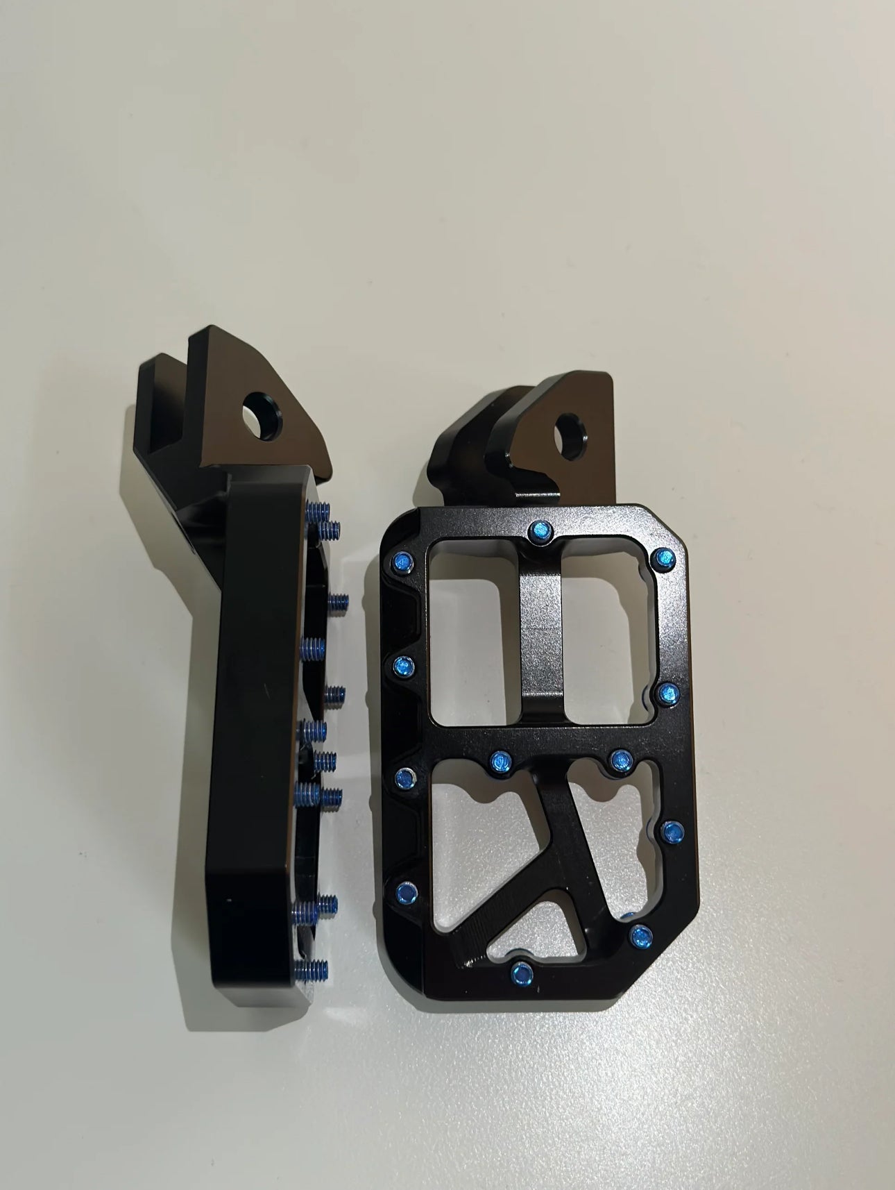 Black with titanium Surron/Talaria/E-ride pro pegs